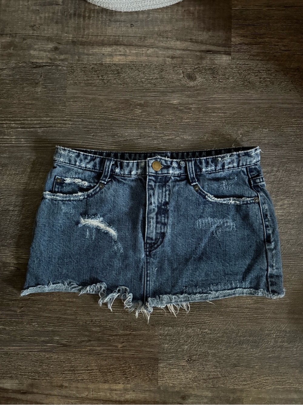 Free People distressed denim mini skirt with a frayed raw hem